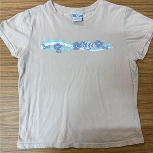 Vintage Roxy Beige Short-Sleeve Tee with Blue Floral Wave Graphic